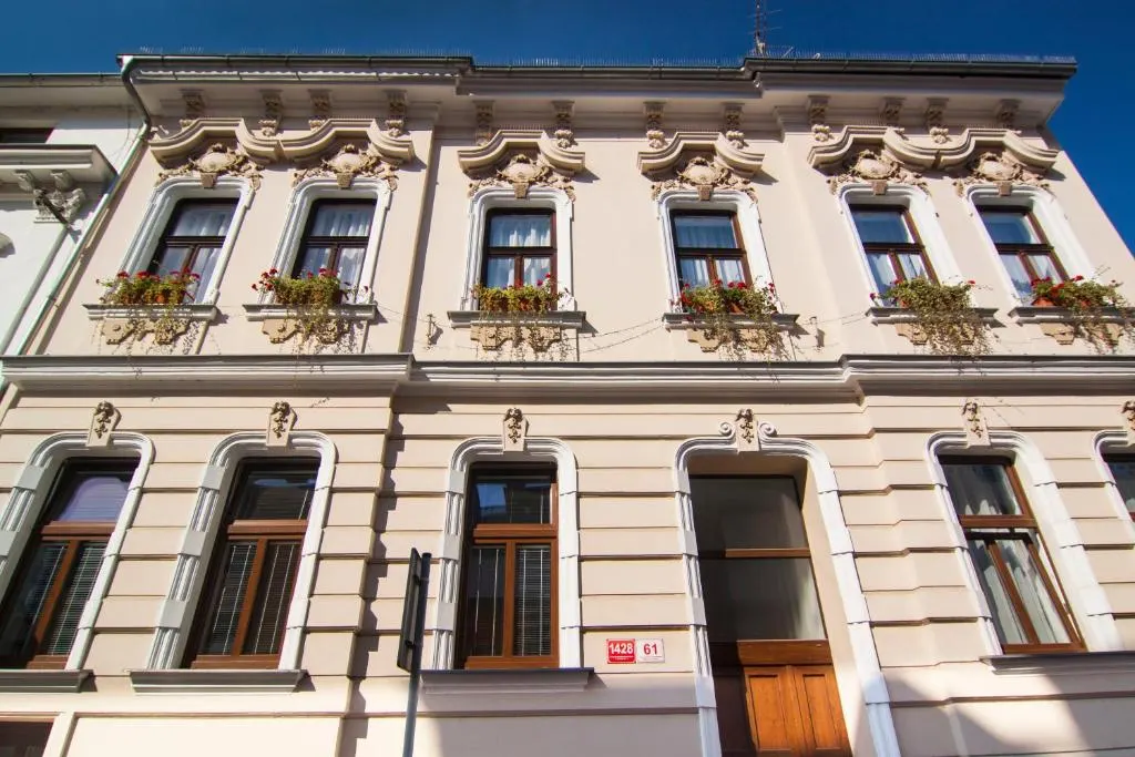 Ornate Art Nouveau guesthouse façade with flowers